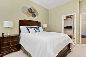 Carpeted bedroom with vaulted ceiling