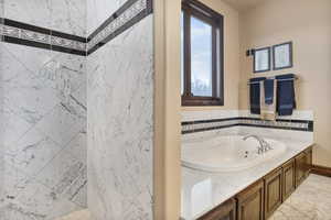 Bathroom featuring tile patterned flooring and a bathtub