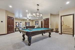 Rec room with pool table, light carpet, and ceiling fan