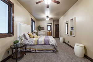 Bedroom featuring carpet floors and ceiling fan