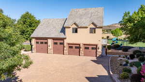 View of front of house featuring a garage and a playground