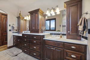 Bathroom featuring tile patterned flooring and vanity