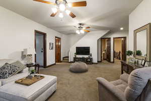 Living room with light carpet and ceiling fan