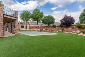 View of yard featuring a balcony