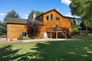 Back of home facing East.  This home has log siding. It is a stick built home.