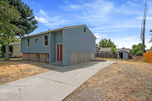 Side View of the Long Driveway and Basement Entrance