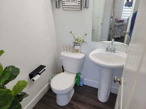 Bathroom featuring toilet and hardwood / wood-style floors