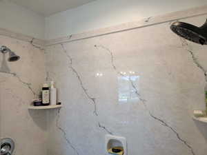 Two shower heads in this spectacular bathroom.  Separate shower and Tub.