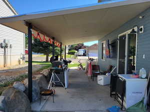 View of patio / terrace.  Wonderful place that is covered and comfortable for shady summer days and evenings.