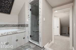 Primary bathroom with plus walk in shower, tile patterned flooring, and vaulted ceiling