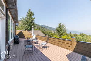 Deck featuring a mountain view and grilling area