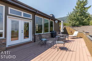 Wooden deck featuring french doors