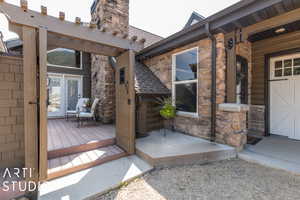 Exterior space featuring a garage and a wooden deck