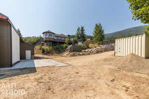 View of yard with a mountain view and a patio