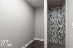 Bathroom with hardwood / wood-style floors