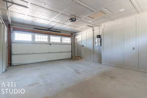 Upper Level Garage featuring a garage door opener