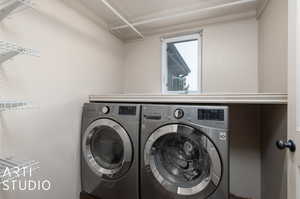 Clothes washing area featuring independent washer and dryer