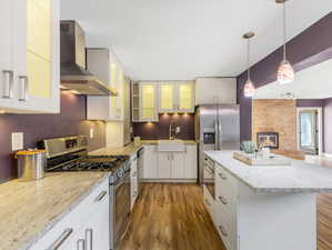 Kitchen with island opens to family room