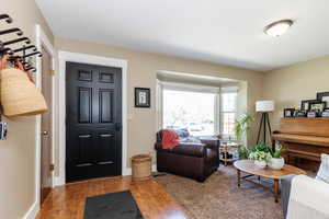 Foyer entrance with hardwood / wood-style flooring