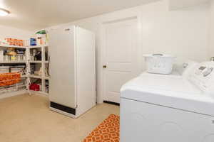 Laundry area featuring washer and clothes dryer