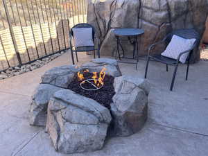 View of patio / terrace with an outdoor fire pit