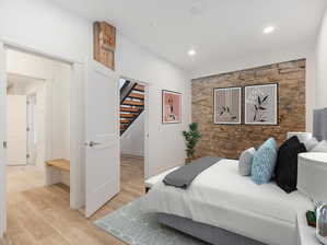 Bedroom with light hardwood / wood-style floors