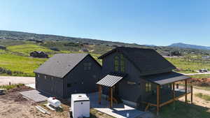 View of front of home featuring a mountain view