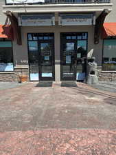 Entrance to property with french doors and stucco siding