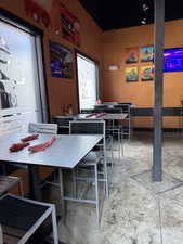 Dining space featuring concrete floors