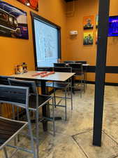 Dining space featuring concrete flooring