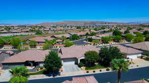 Birds eye view of property with a mountain view