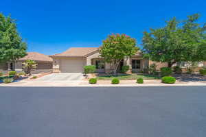 View of front of house with a 2.5 car garage w/24' wide garage door.