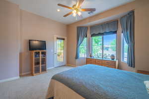 Owner bedroom #2 featuring access to exterior and ceiling fan