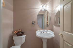 Half Bathroom with pedestal sink & toilet