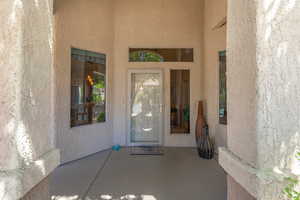 View of exterior entry. Transom window & Side-light