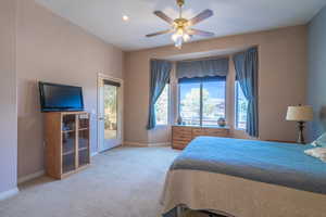 Owner Bedroom #2 featuring access to outside, light carpet, and ceiling fan