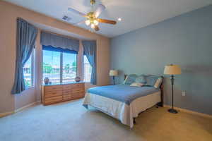 Carpeted Owner Bedroom #2 with Bay Window, & ceiling fan