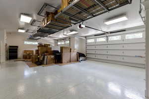 Extra wide garage w/powder room & epoxy flooring