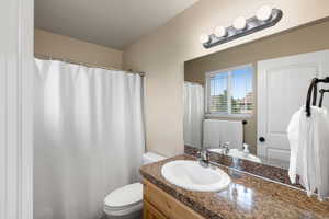 Bathroom with vanity and toilet