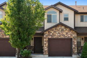 View of front of property featuring a garage