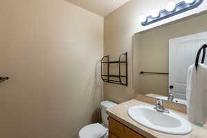 Bathroom with toilet and vanity