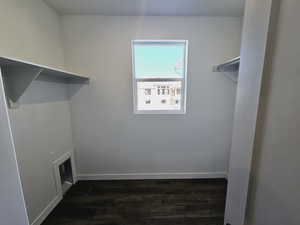 Washroom with dark hardwood / wood-style flooring