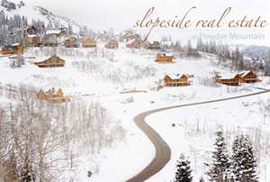 Snowy aerial view with a mountain view