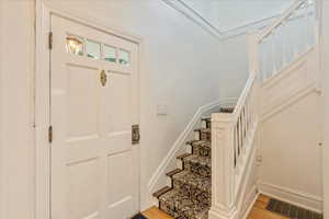 Entryway with light hardwood / wood-style flooring