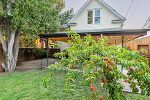 View of front facade with a patio area and a front yard