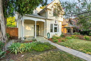 View of front property featuring a porch and a front lawn