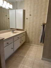 Bathroom featuring vanity and tile patterned floors