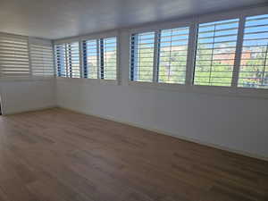 Spare room with hardwood / wood-style flooring