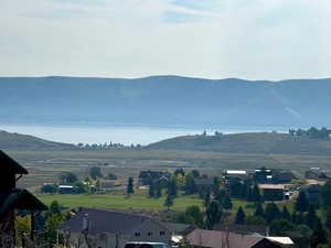 Property view of mountains with a water view