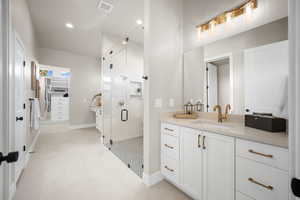 Bathroom featuring vanity and walk in shower